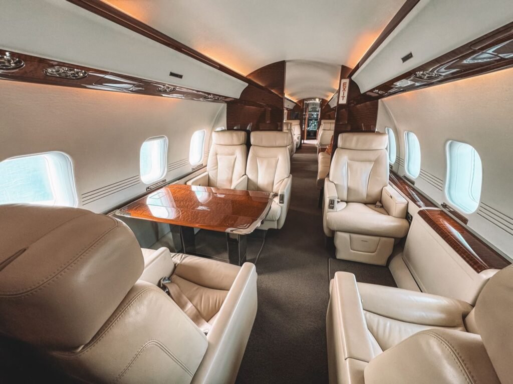 Mastering the First Impression: Your intriguing post title goes here Luxurious interior of a private jet showcasing leather seating and elegant wooden trim.
